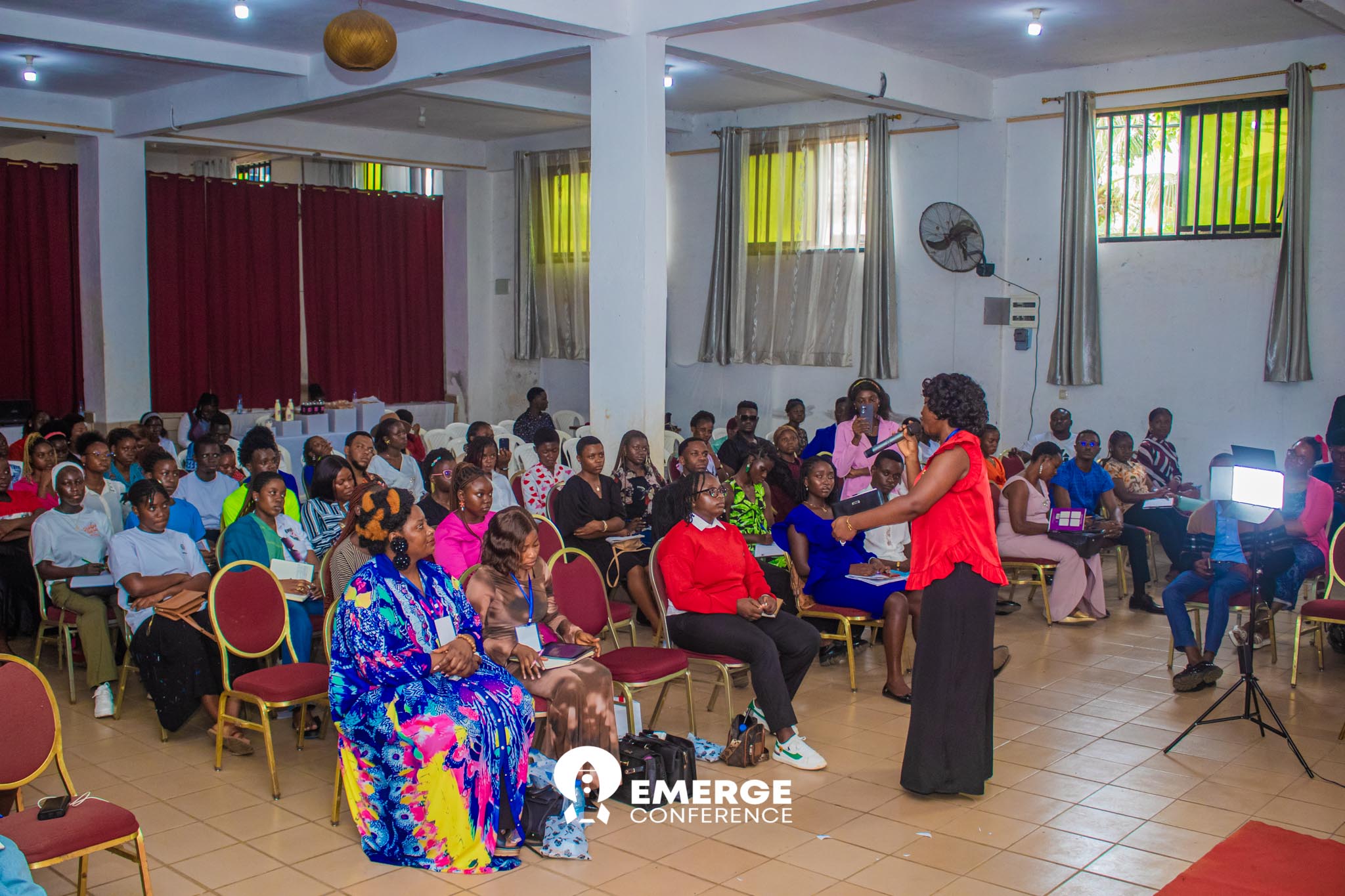 Packed audience and speaker